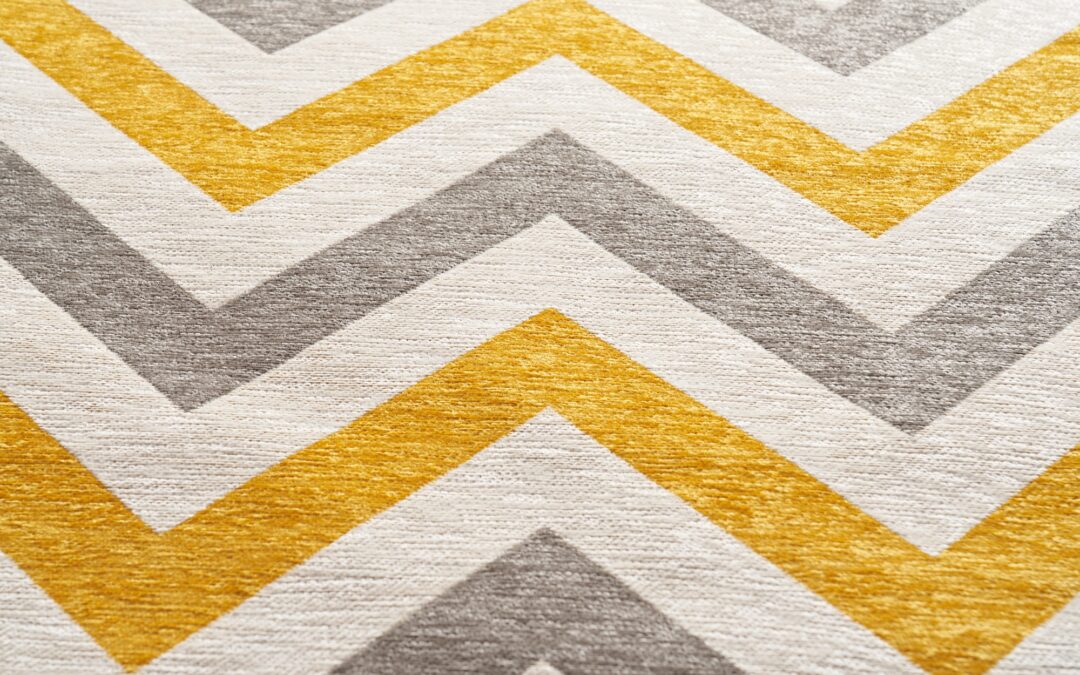 Colorful fabric texture with zigzag, geometric pattern print background.