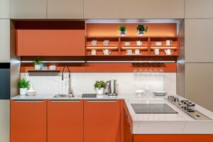 Interior of modern kitchen in orange color