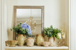mirror, beige set with and flowers on shelf
