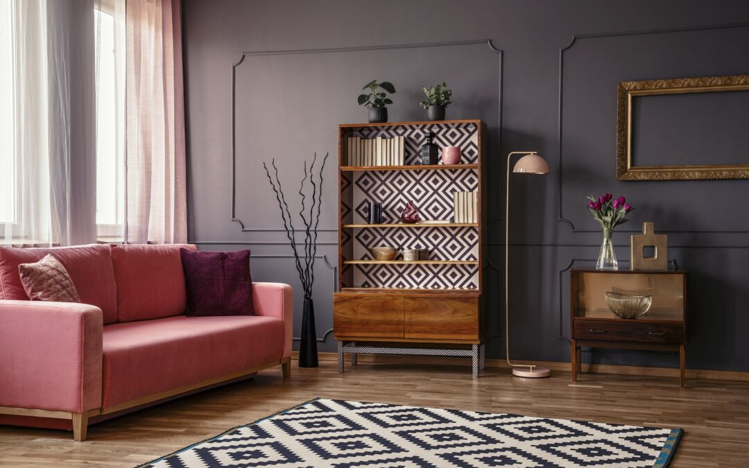 Retro wooden cupboard with books and decorations standing in dar